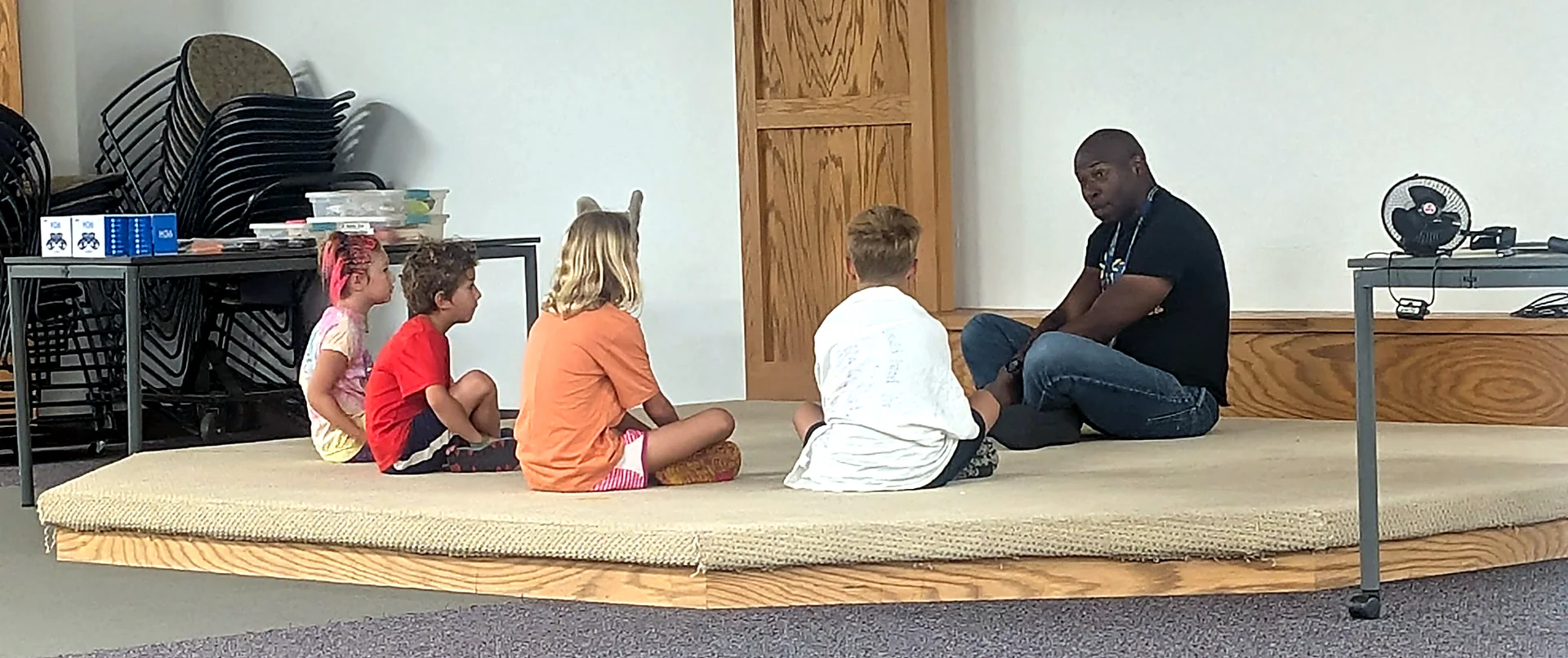 GoSolar! Kidz instructor leading students in a group learning circle