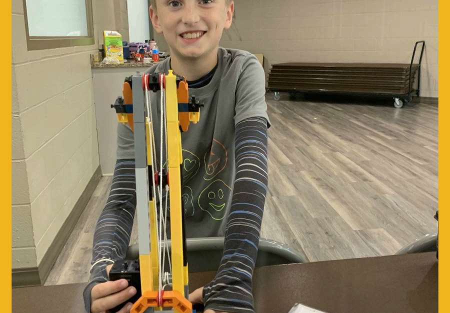 Kid building a solar robot